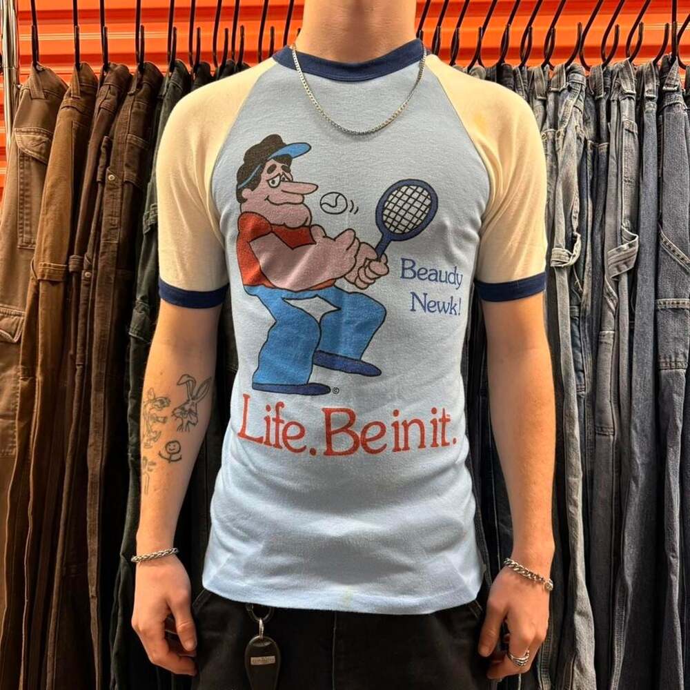 True Vintage 70s Life. Be In It. Norm Tennis Ringer Raglan Tee — Baby Blue